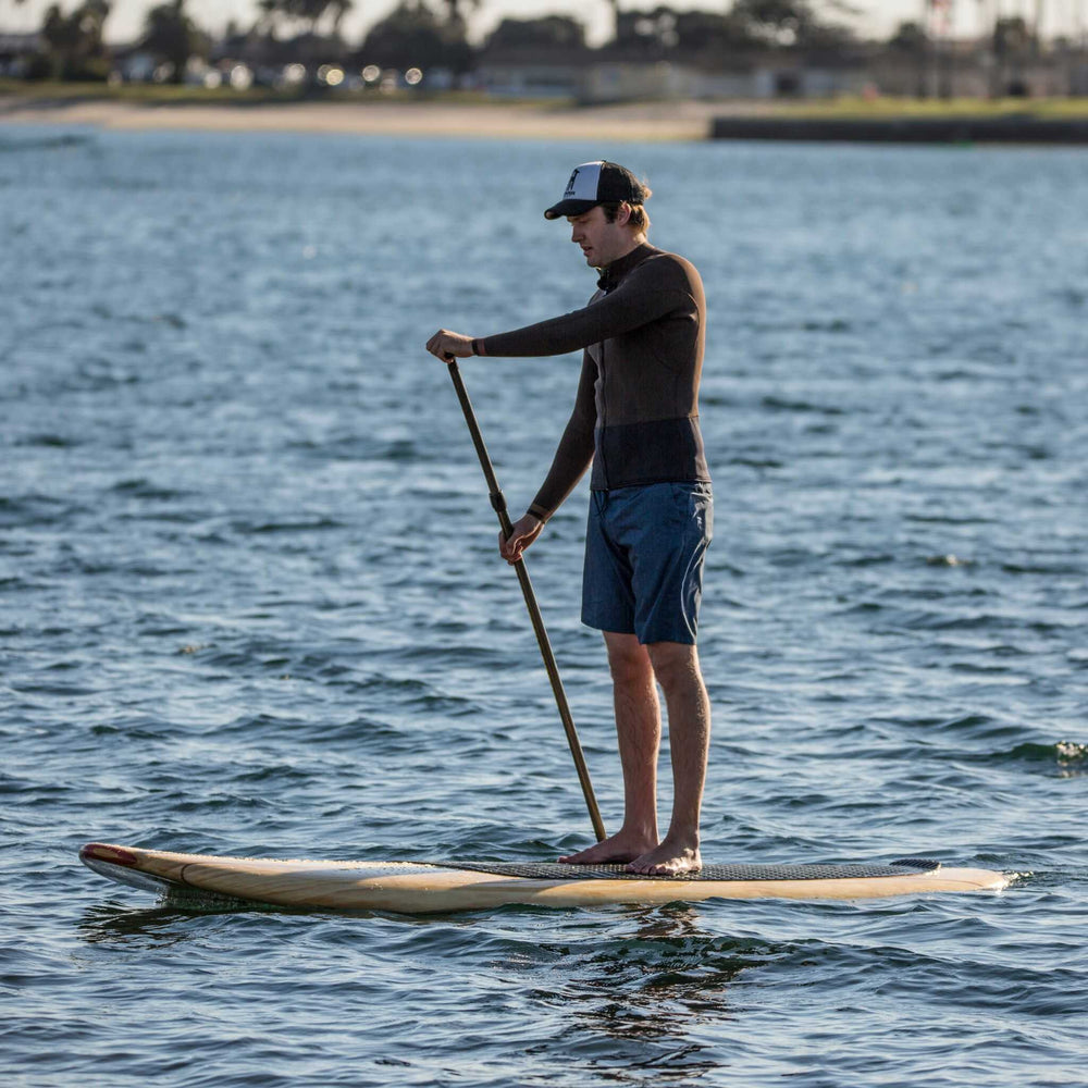 Man riding a Tower paddle board