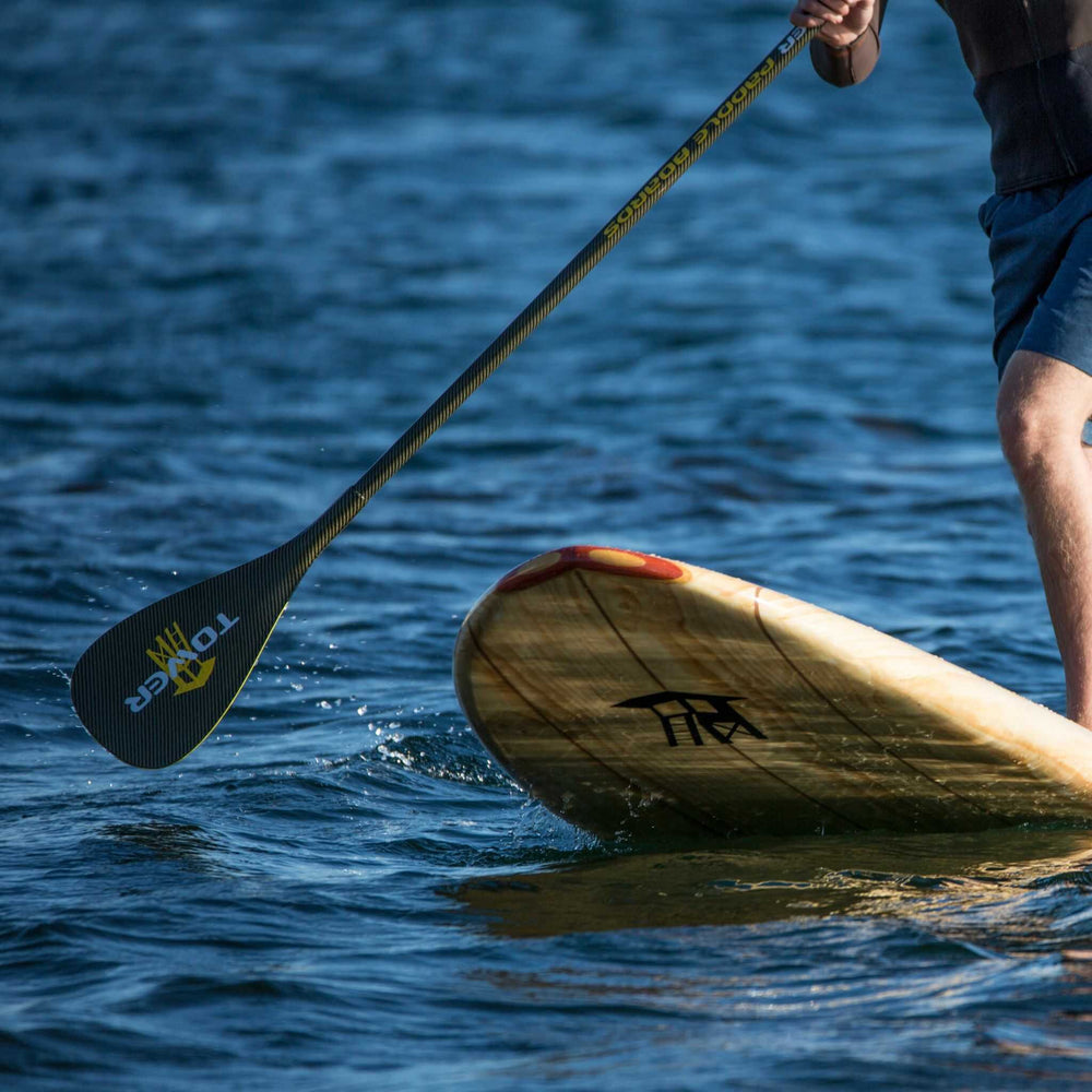 carbon Kevlar Tower SUP paddle being used with Tower paddle board