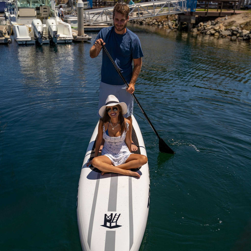 Couple riding on a Tower Xplorer board